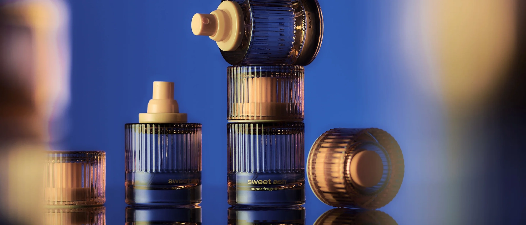 Snif fragrance bottles lined up in blue light