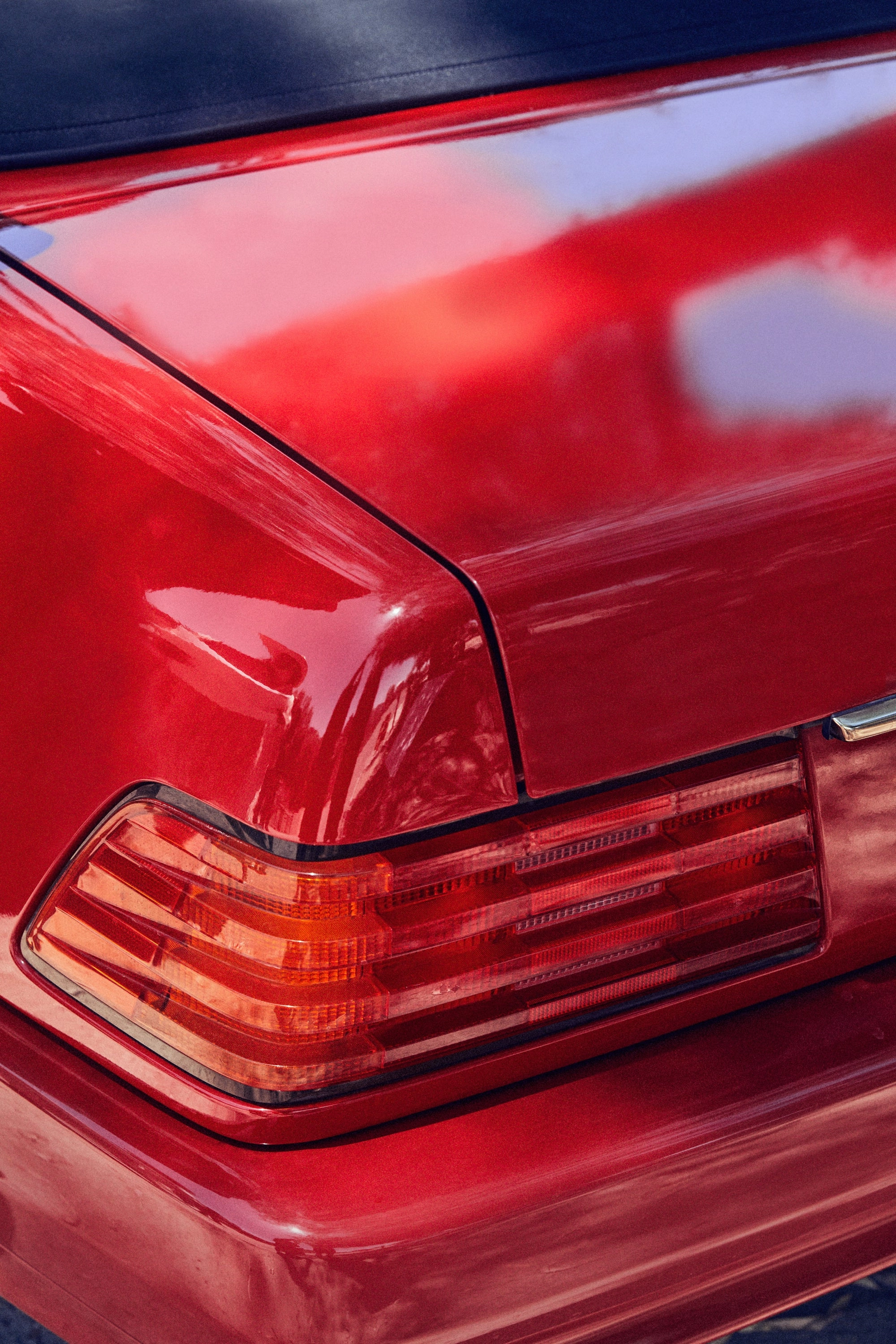 The rear light of a red classic car