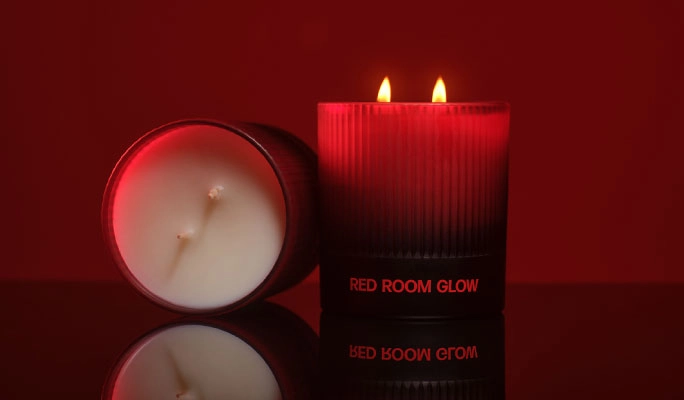 Red Room Glow candles burning in a dark red room
