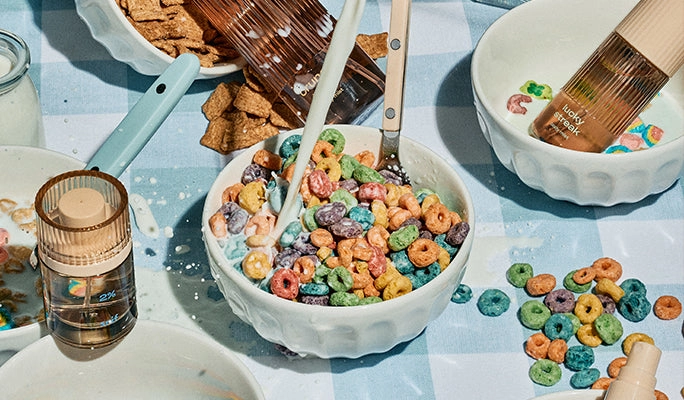 A bowl of cereal and milk on a tiled table