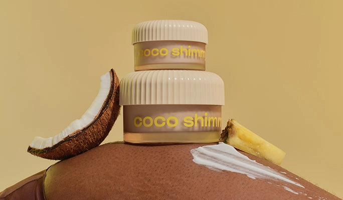 A coco shimmy body whip jar resting on a coconut half