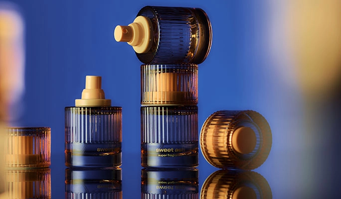 Tall Snif bottles in blue and gold light